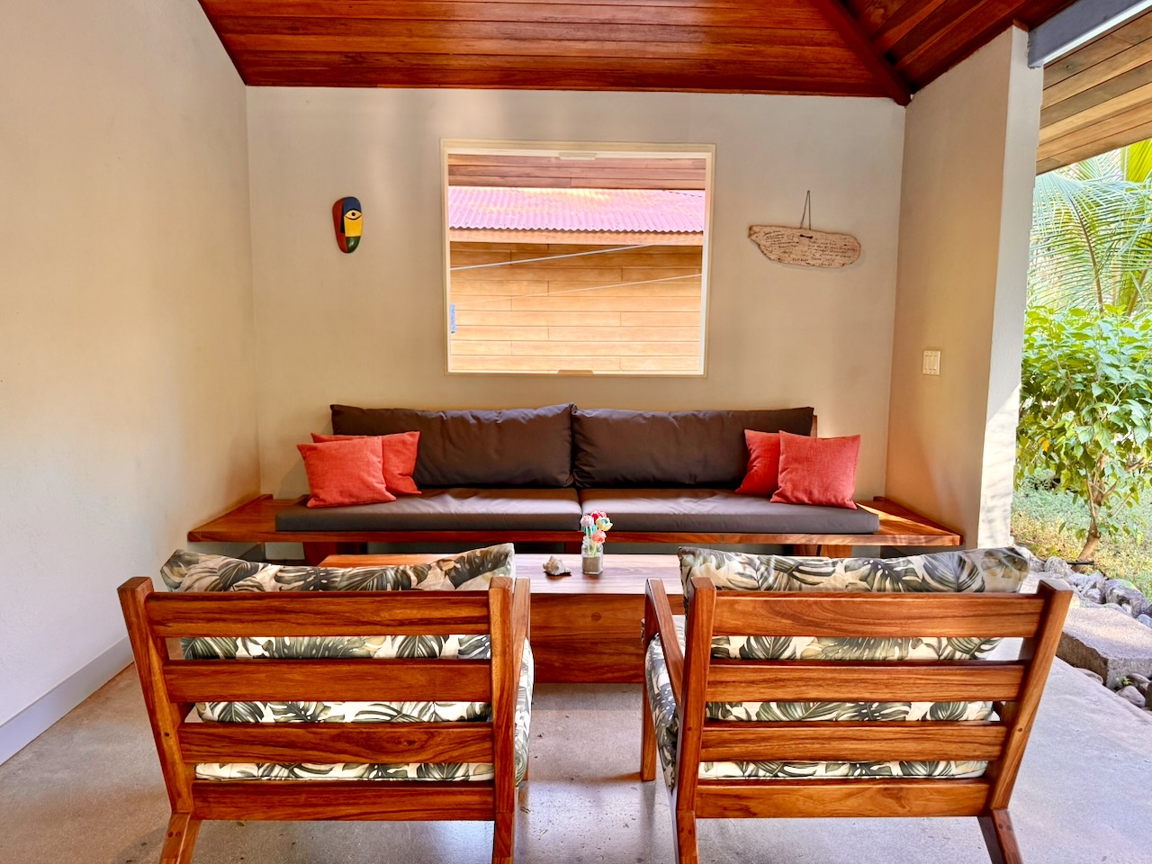 Wooden furniture seating area with tropical cushions