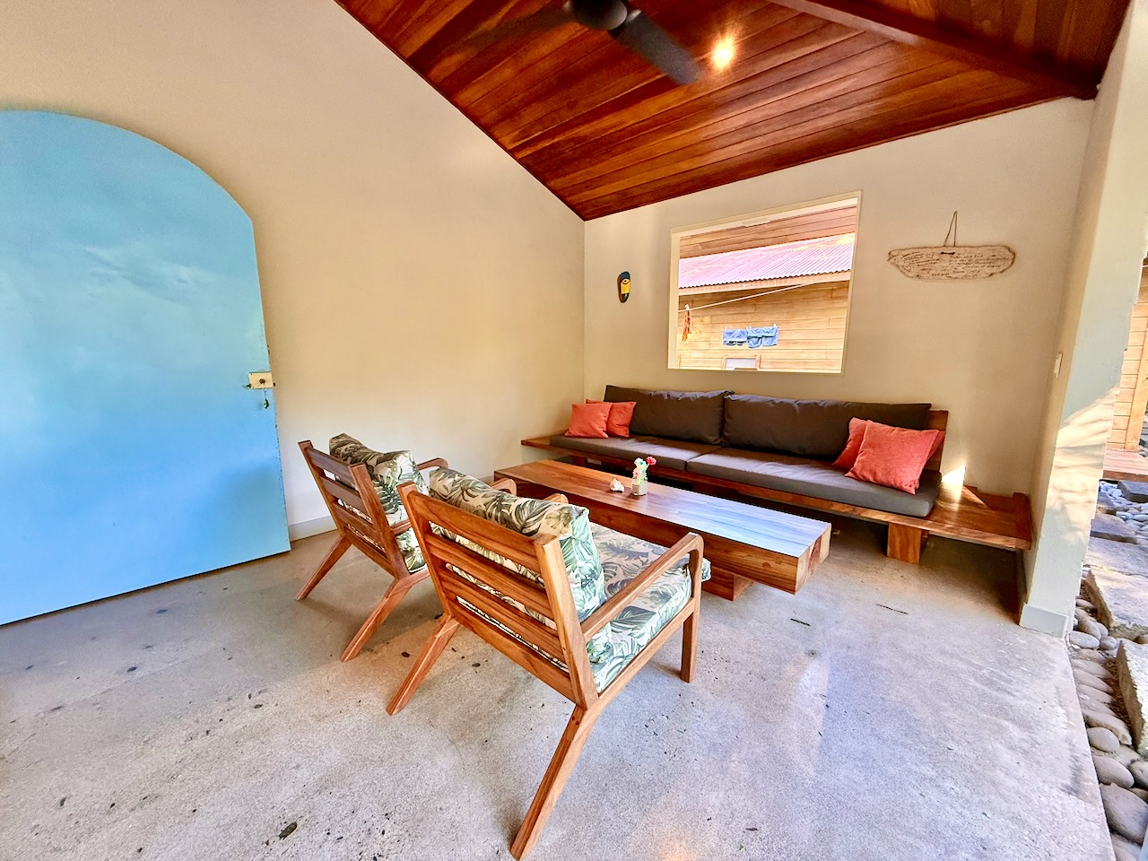 Blue arched door and lounge seating